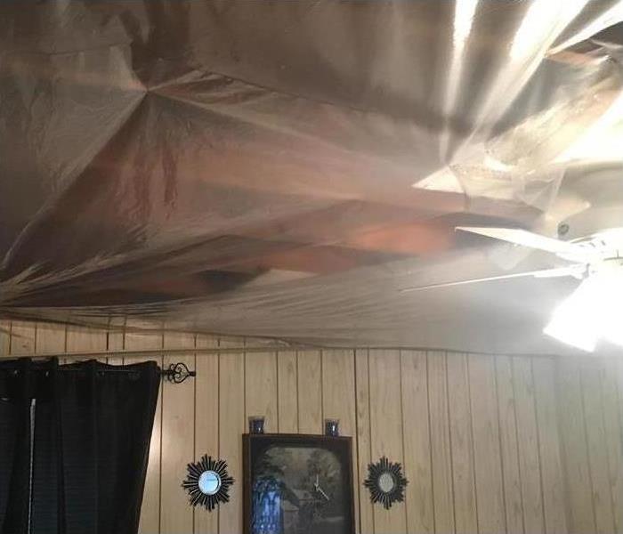 exposed dry ceiling beams covered with protective plastic in Memphis, TN