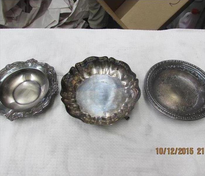 tarnished and soot covered silver dishes at the SERVPRO of Southeast Memphis warehouse