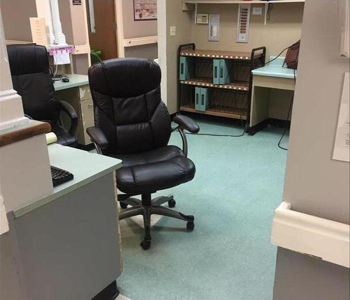 medical office with black chairs blue carpet and gray walls in Memphis, TN