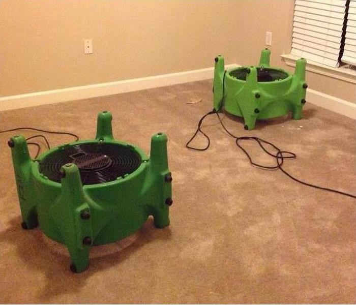 SERVPRO air movers drying water soaked carpet in apartment in Memphis, TN