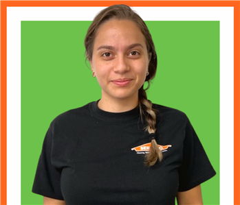 Oriana, SERVPRO employee, cut out and set against a green backdrop